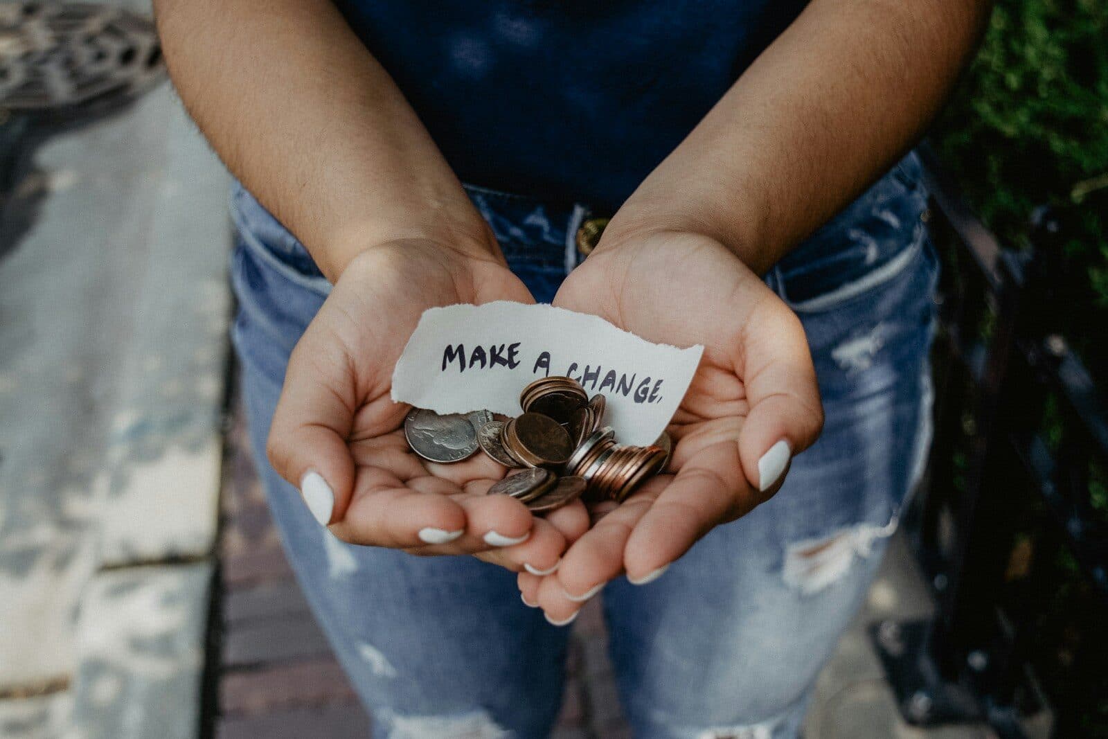 Announcing Haketi Gives: Modern, High-Performance Web Design for Organizations Doing Essential Good | Haketi person showing both hands with make a change note and coins